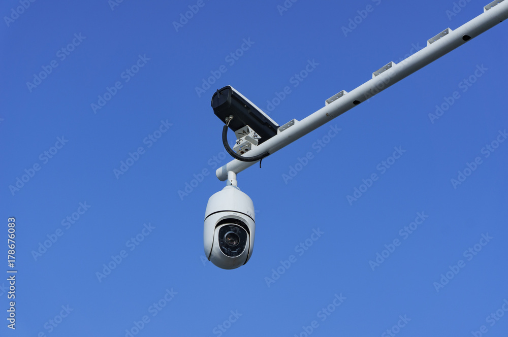 Security cameras with blue sky background Security cameras with blue sky background
