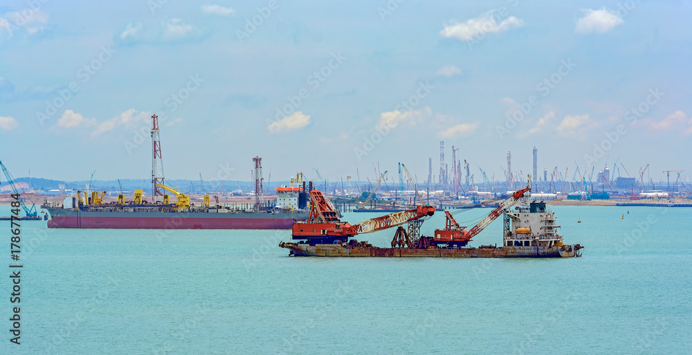 Fototapeta premium Dredger vessels anchored in Johor strait.