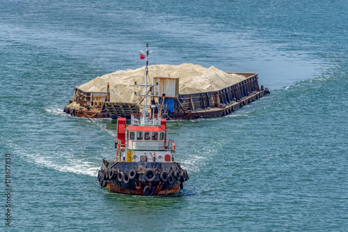 Tug boat with a barge
