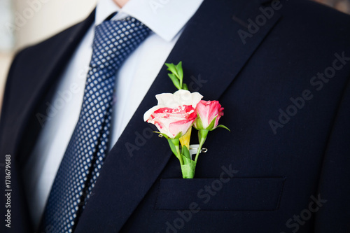 Wedding boutonniere on suit of groom