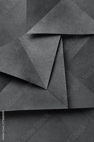 Geometric shapes of paper, grey background