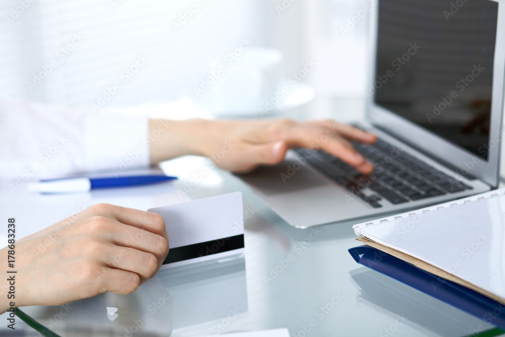Close up of business woman hands typing on laptop computer Close up of business woman hands typing on laptop computer