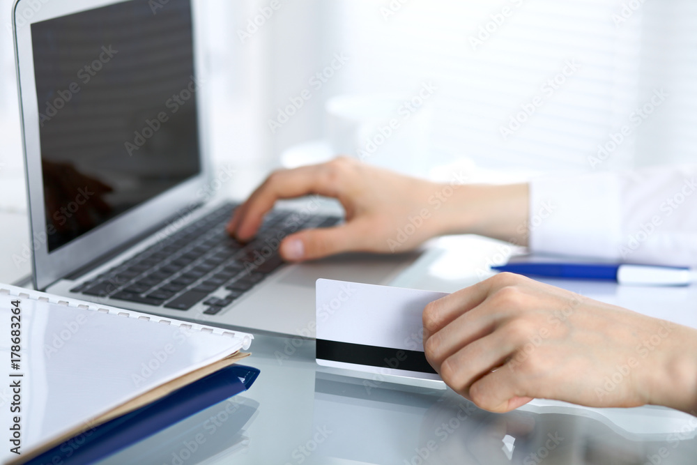 Close up of business woman hands typing on laptop computer Close up of business woman hands typing on laptop computer
