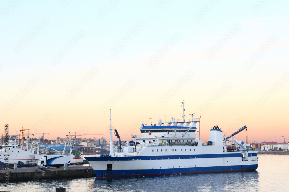 fishery research vessel in the port at sunrise