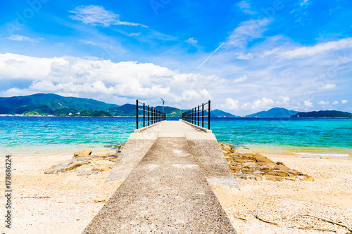 The Suri beach and Pier.I shot in Suri Beach, Kakeroma Island, Kagoshima Prefecture, Japan. photo