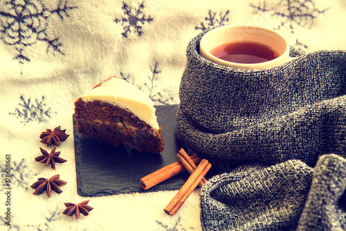 Tea with cake, cinnamon and anise photo