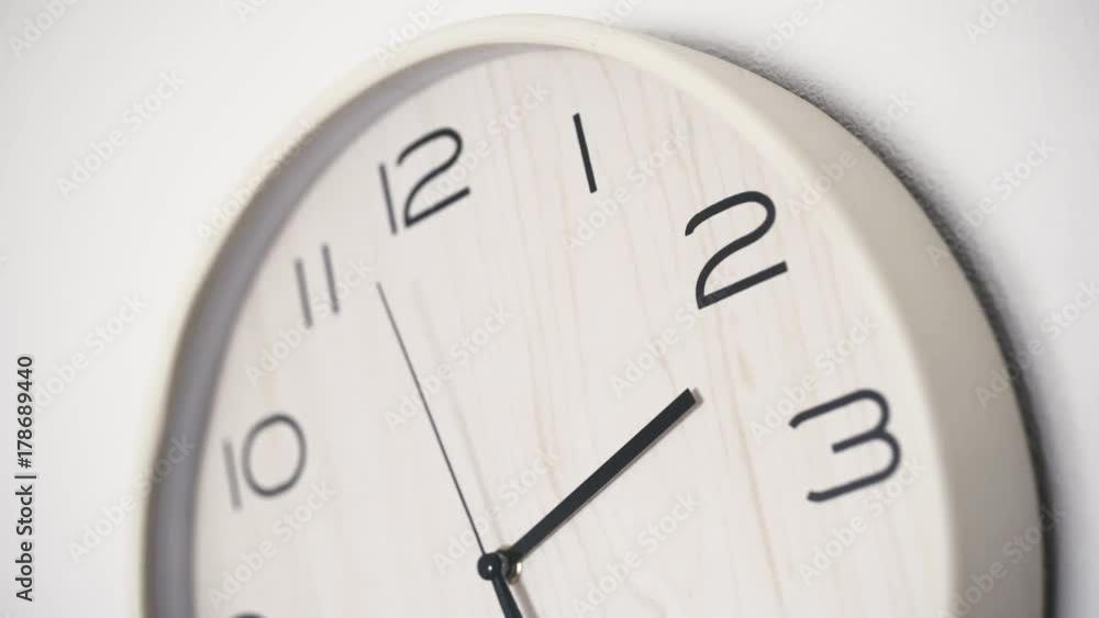 Close up white clock with big black numbers dial. Modern design Close up white clock with big black numbers dial. Modern design