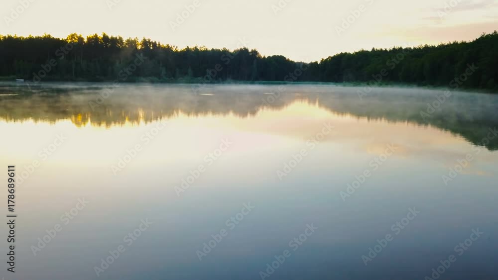 beautiful misty lake during sunrise beautiful misty lake during sunrise