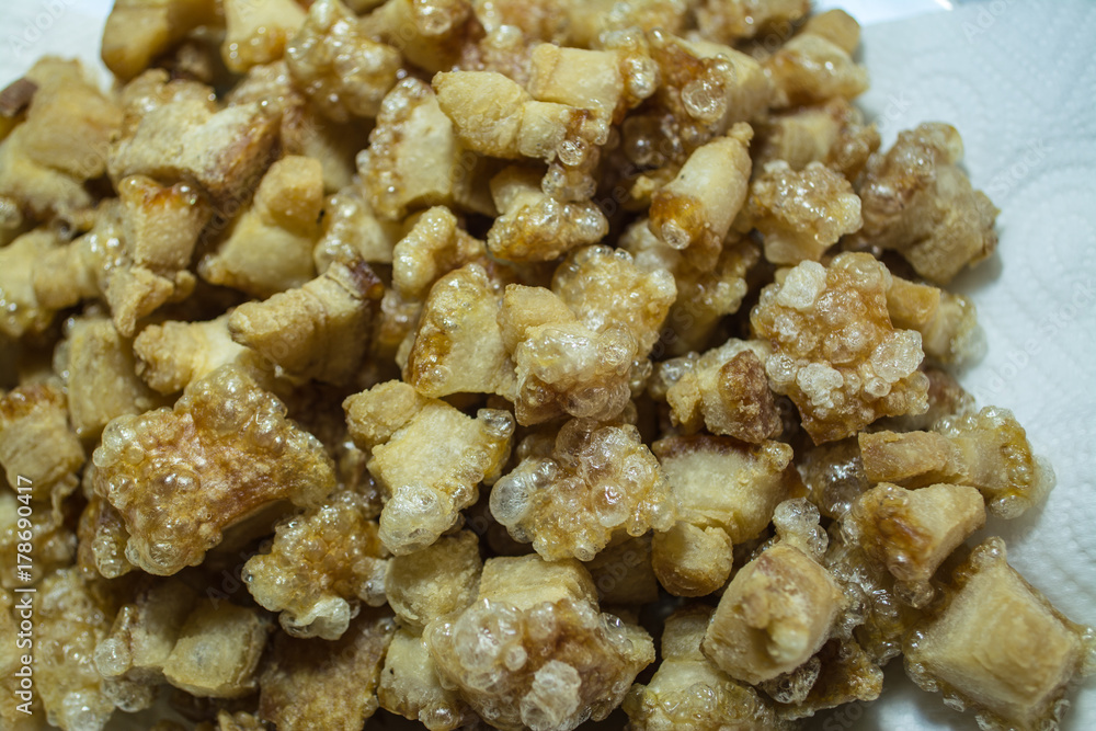 Cracking pork is crisped pork fat left in the pan after being fired for lard. Cracking pork is crisped pork fat left in the pan after being fired for lard.