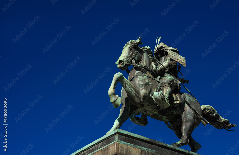Fototapeta premium Kusunoki Masashige samurai bronze equestrian statue erected in 1897 in the center of Tokyo (with copy space)