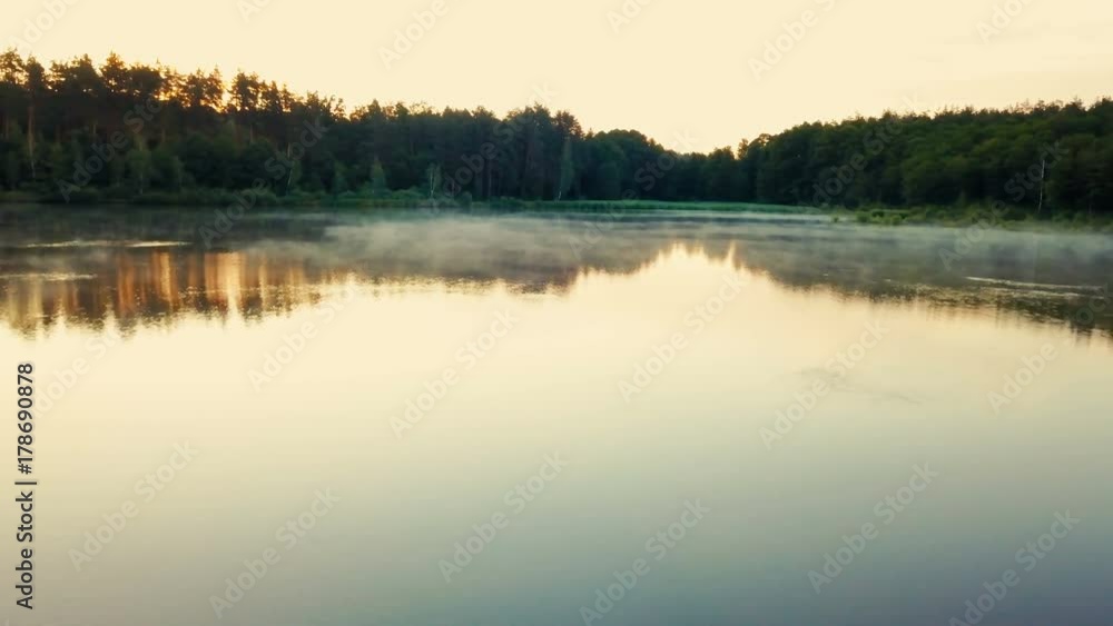beautiful misty lake during sunrise beautiful misty lake during sunrise