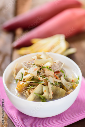 Thai food (Kaeng Hua Plee), spicy banana flower soup with pork in a bowl photo