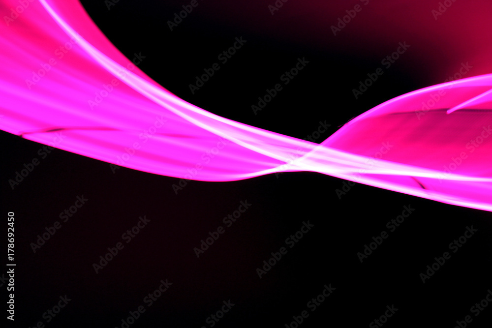 Pink neon light ribbon due to long exposure time and camera shake Pink neon light ribbon due to long exposure time and camera shake