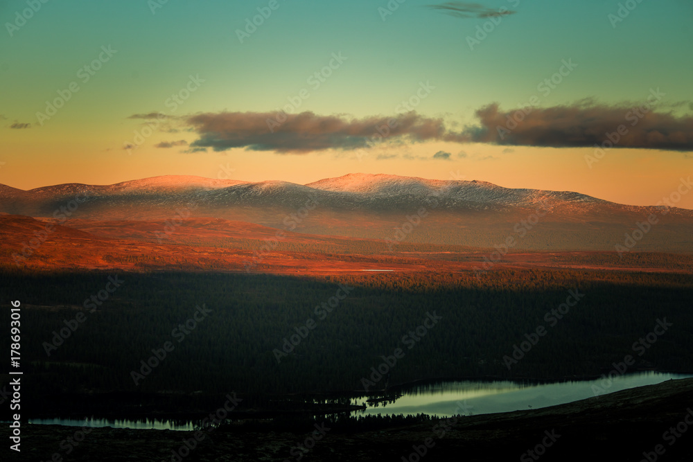 A beautiful, colorful sunset in mountains. Beautiful autumn in Norway. Abstract colorful look.