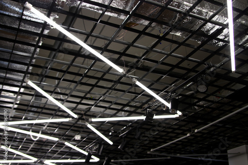 Fluorescent lamps on the hi-tech ceiling - included daytime lamps - bright light