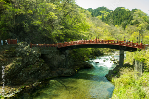Japan traditional wooden arch bridge over river