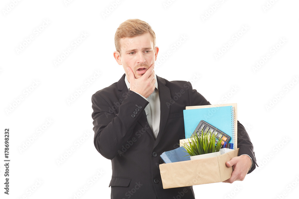 Portrait of young man holding box with personal belongings on white background Portrait of young man holding box with personal belongings on white background