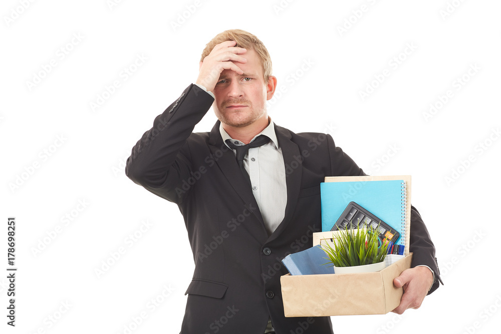 Portrait of young man holding box with personal belongings on white background Portrait of young man holding box with personal belongings on white background