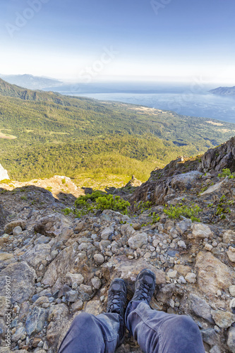 Portrait view of a hikers legs near the summit of Mount Egon, an active stratovolcano on East Nusa Tenggara in Indonesia.