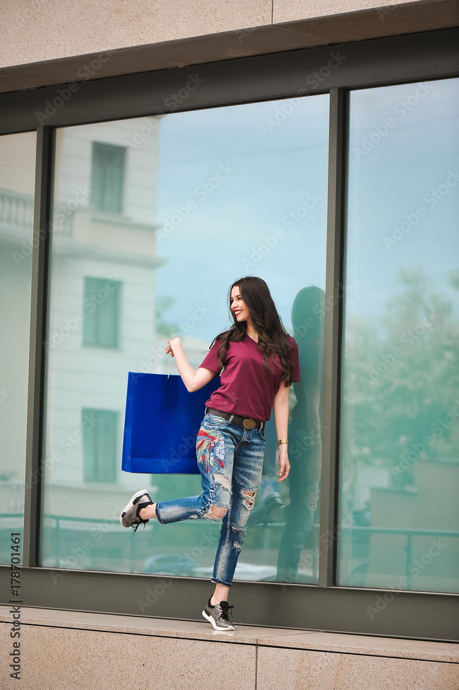 Joyful girl enjoying shopping in city Joyful girl enjoying shopping in city