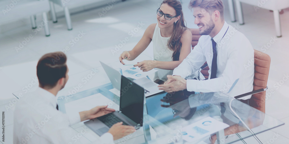 Fototapeta premium Three successful business person working. High view