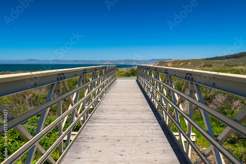 Exploring the Pacific shoreline at Spooner's Cove, Bluff Trail, Montana de Oro State Park, Morro Bay, San Luis Obispo County, California, USA