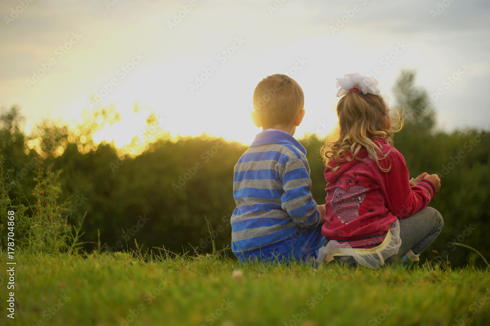 two kids Children on Sunset, romantic boy and girl two kids Children on Sunset, romantic boy and girl