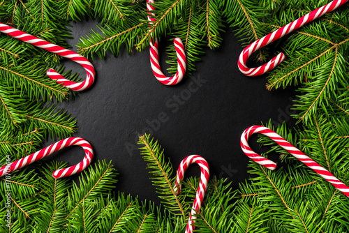 Christmas background with candy canes and christmas tree. Top view