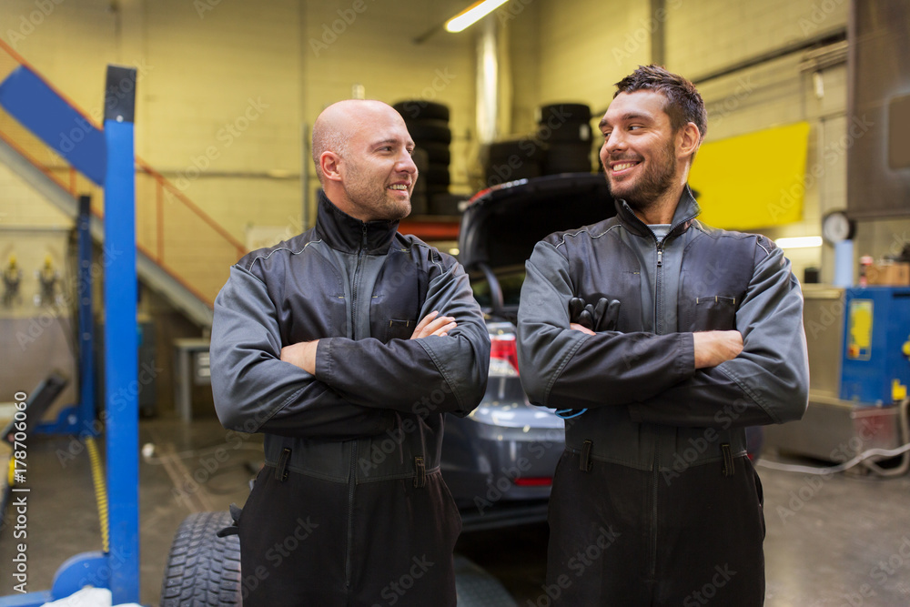 auto mechanics or tire changers at car shop auto mechanics or tire changers at car shop