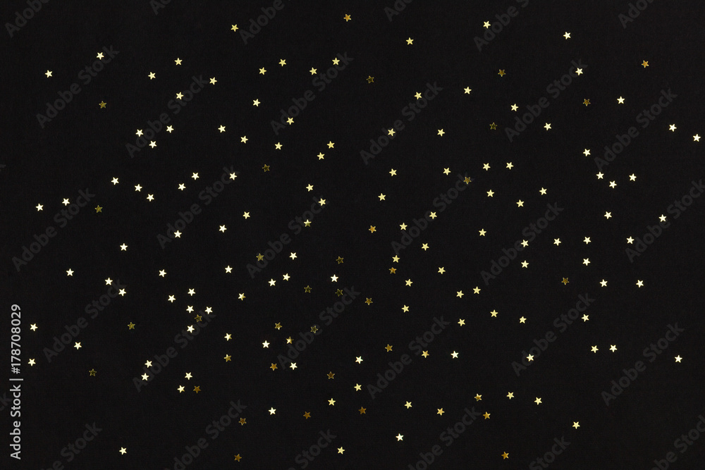 Golden stars on black background