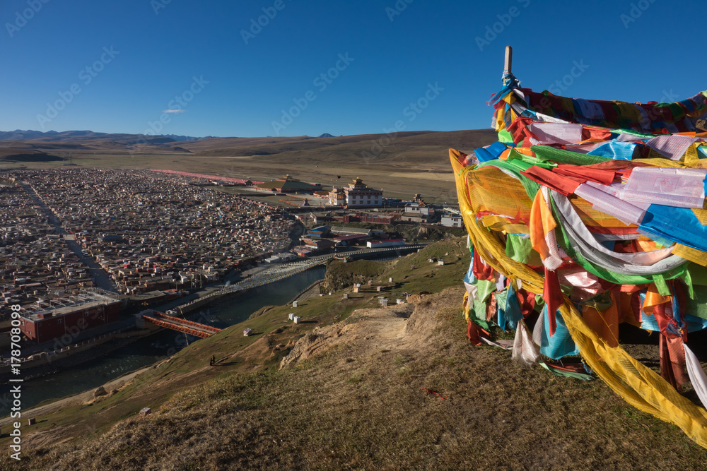 View of the Yarchen Gar Monastery with many shacks for monks in Garze Tibetan, Sichuan, China.