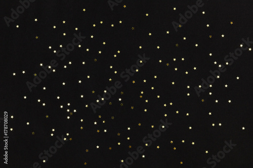 Golden stars on black background