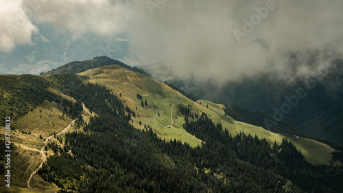 Breathtaking view on forest hills and grassland of beautiful Romania country in Rodna mountain area