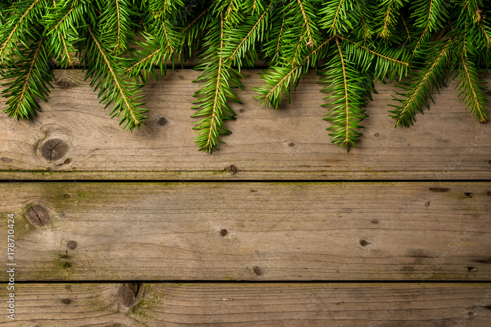 Christmas tree over an old wooden table. Christmas decoration Christmas tree over an old wooden table. Christmas decoration