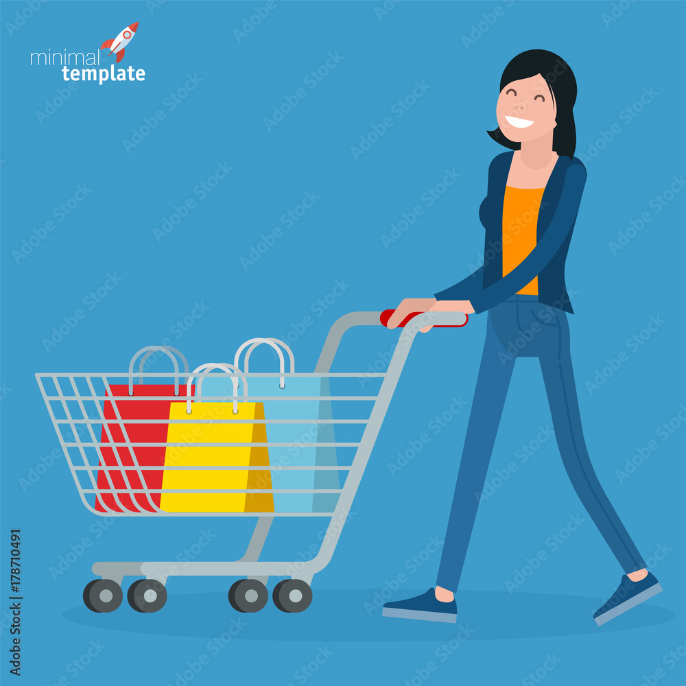 Young woman walking with shopping cart. Young woman walking with shopping cart.