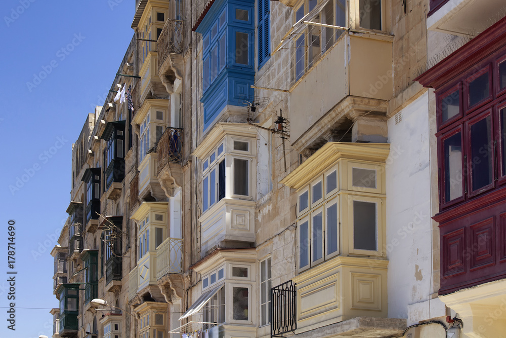 Close up view of old, historical buildings in Valletta / Malta. Image shows architectural style of the city and lifestyle. It's the capital of the Mediterranean island nation of Malta.