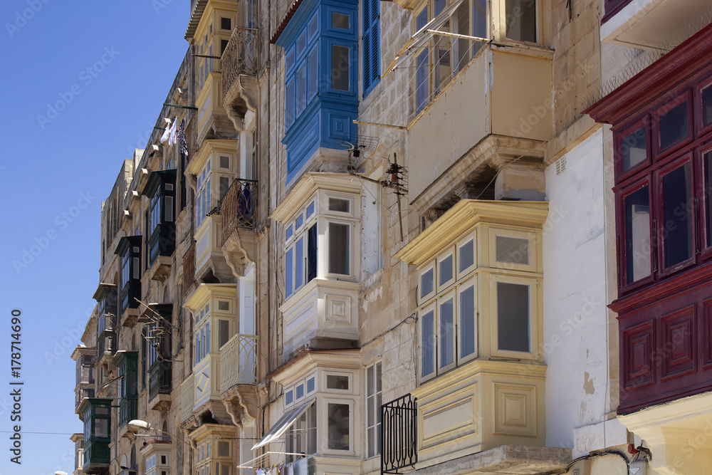 Close up view of old, historical buildings in Valletta / Malta. Image shows architectural style of the city and lifestyle. It's the capital of the Mediterranean island nation of Malta. Close up view of old, historical buildings in Valletta / Malta. Image shows architectural style of the city and lifestyle. It's the capital of the Mediterranean island nation of Malta.