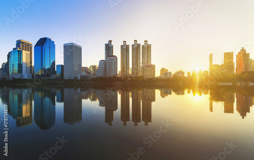 amazing impressive cityscape with beautiful sunrise and skyscraper in downtown with skyline at morning freshness new day concept. © thithawat