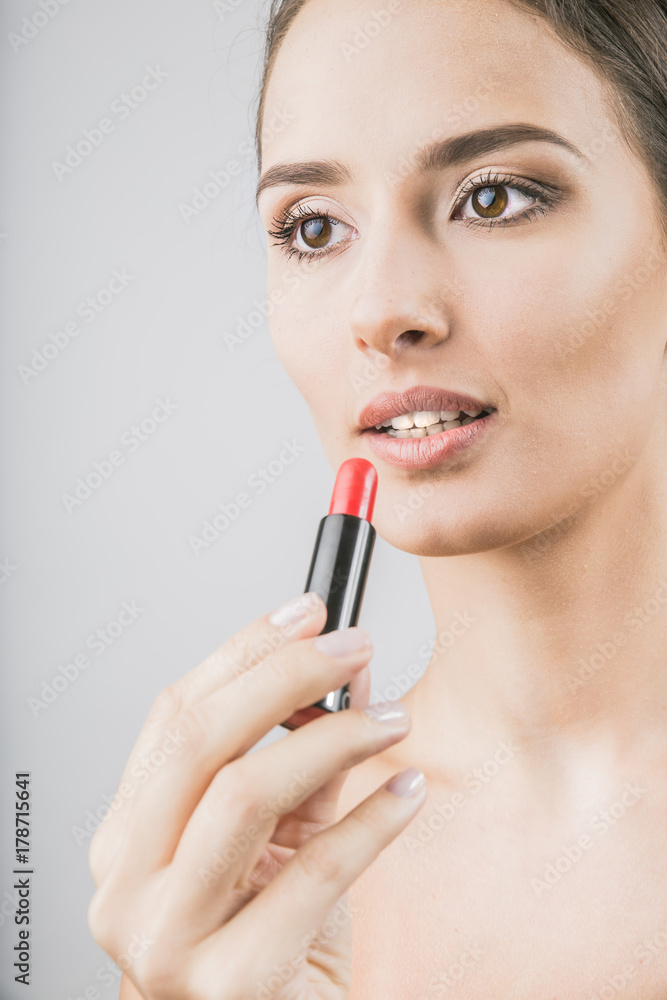 beautiful girl holds lipstick
beautiful girl holds lipstick