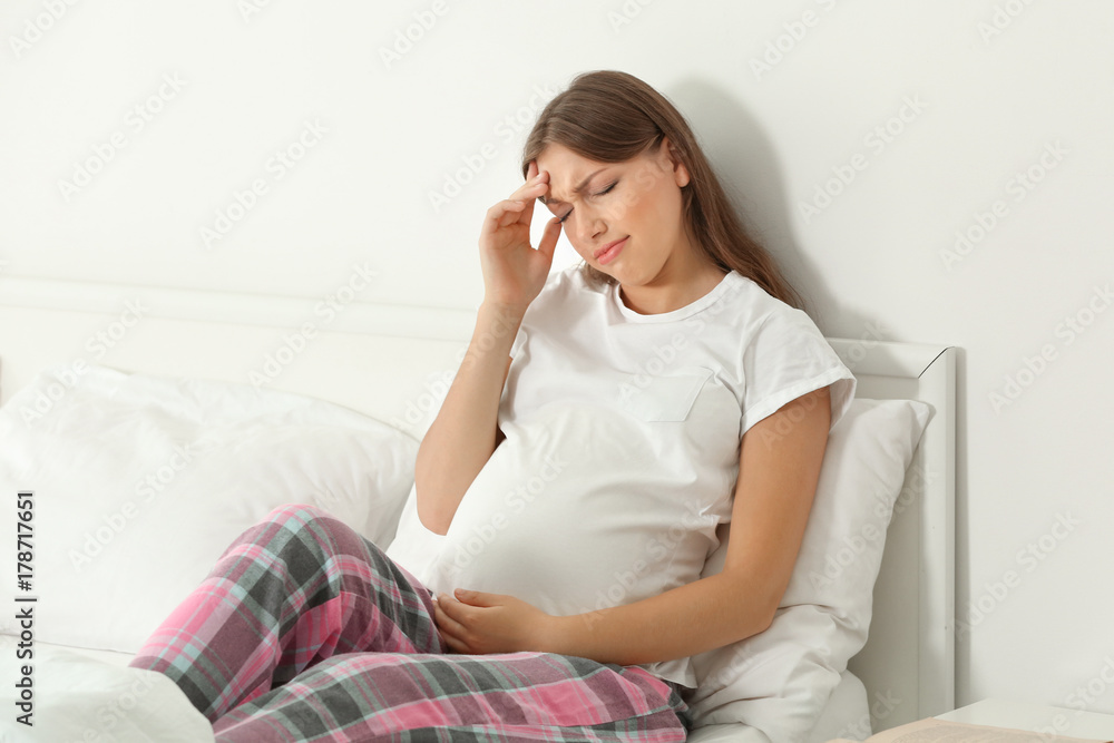 Young pregnant woman suffering from headache Young pregnant woman suffering from headache