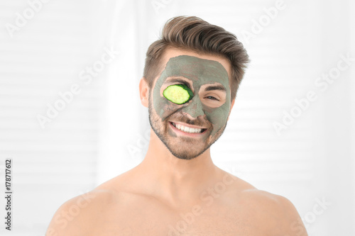 Young man with cosmetic mas...