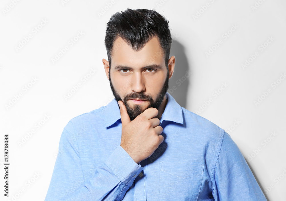 Serious man on light background Serious man on light background