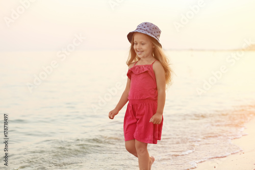 Cute little girl on sea beach © Africa Studio