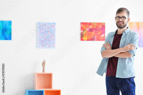 Young man in art gallery