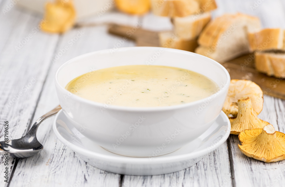 Fresh made Creamy Chanterelle Soup on a rustic background Fresh made Creamy Chanterelle Soup on a rustic background