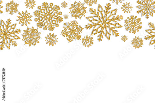 Christmas frame with gold snowflakes. Border of sequin confetti. Glitter powder sparkling background