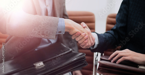 businessman shaking hands to seal a deal with his partner © ASDF