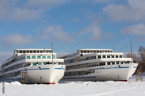 two passenger three-deck motor ships in winter backwater