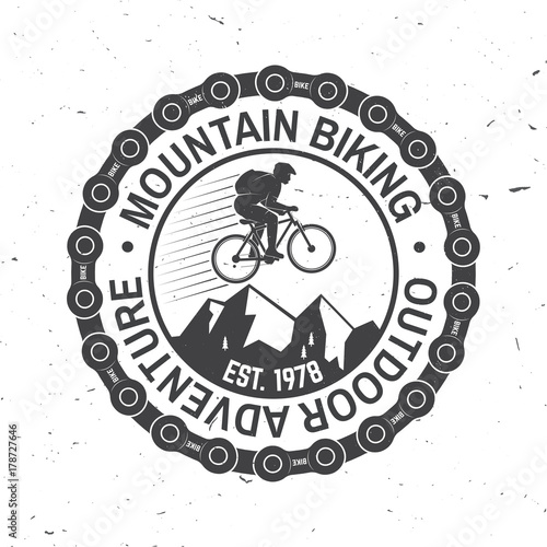 Vintage typography design with car and trailer, mountain bikes and mountain silhouette.