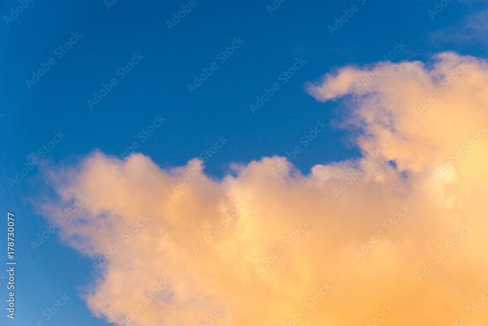 orange clouds in front of blue sky 